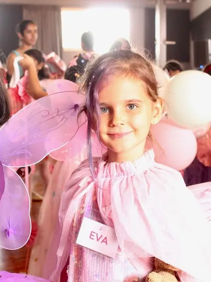 Three little dancers dressed as fairies and party guests for our Nutcracker celebration.