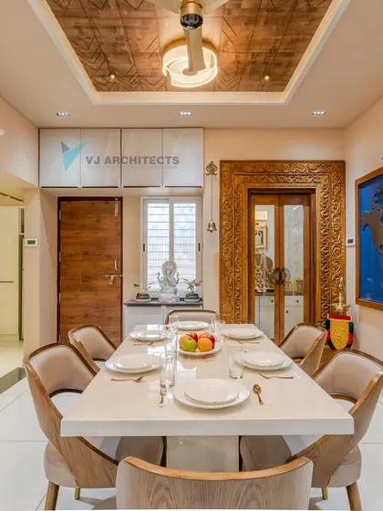 The dining room features a custom-carved wooden doorframe and a unique coffered ceiling with a textured finish, adding layers of craftsmanship to the space.