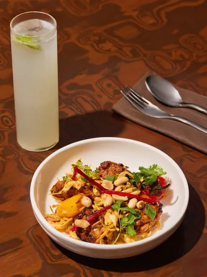 Our three-pepper chicken tikka, served with a tall, cool glass of our house-made soda. A perfect pairing for a warm afternoon.
