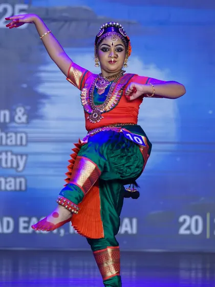 A dynamic shot of a student executing a powerful leg lift. Her energetic performance secured a 1st place win in the junior category.