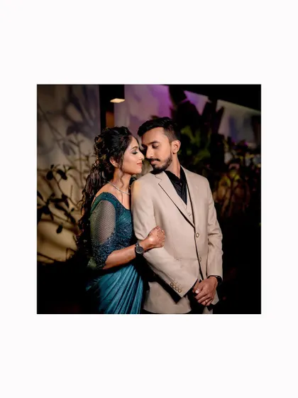 A classic couple's pose from Sushma and Athmic's Sangeet night.