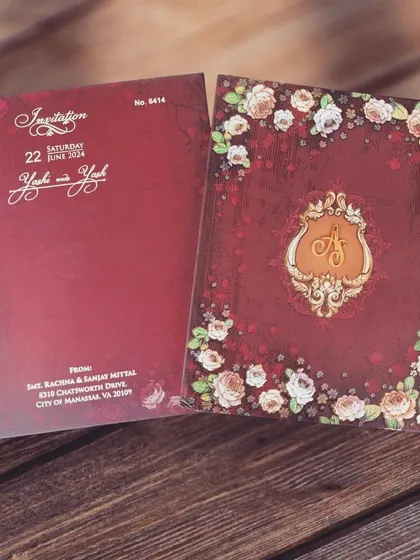 Indulge in timeless elegance with this exquisite maroon wedding invitation adorned with delicate floral details. A perfect blend of tradition and luxury.