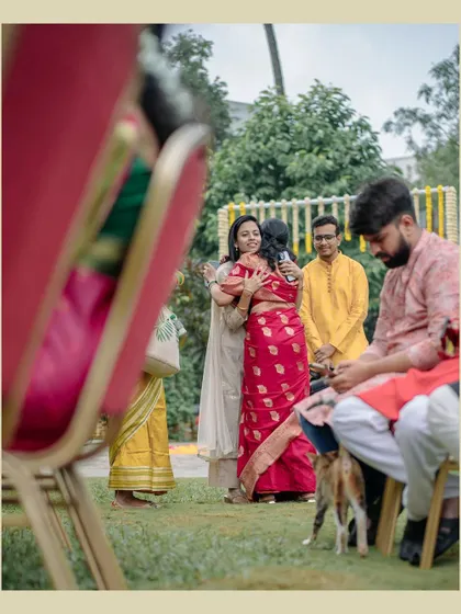 A warm hug between guests at a wedding. We believe in capturing the love and connection between not just the couple, but all the people who are there to celebrate them.
