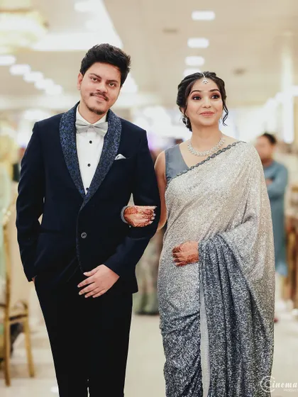A classic walking shot of the newly engaged couple, capturing their style and the beginning of their journey together.