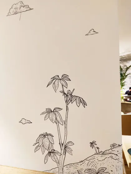 This hand drawn tree illustration adds a touch of nature and whimsy to a pillar in the restaurant.