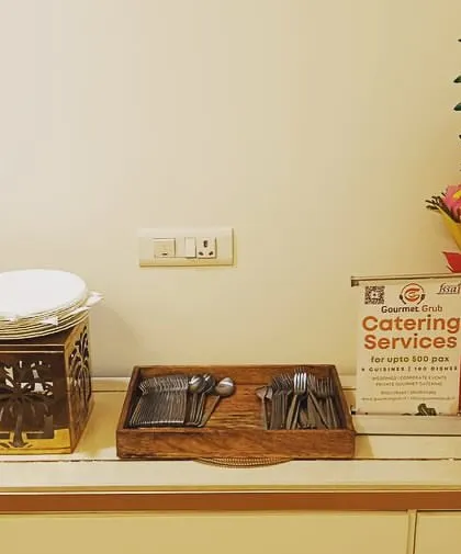 A compact setup for 40 guests in Sector 31, Gurgaon. This image shows my catering services sign and a beautiful fruit bouquet, which can be a lovely addition to any event.