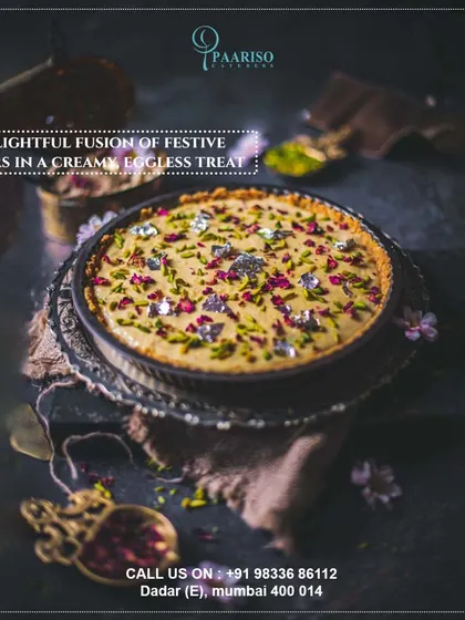 A delightful fusion of festive flavors in a creamy, eggless dessert tart. This modern creation is garnished with edible silver foil, rose petals, and pistachios, perfect for contemporary celebrations.