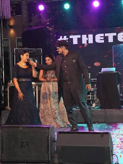 On stage during a Sangeet in Goa, engaging with the bride's family. I make it a point to involve key family members in the fun, creating special moments for them.