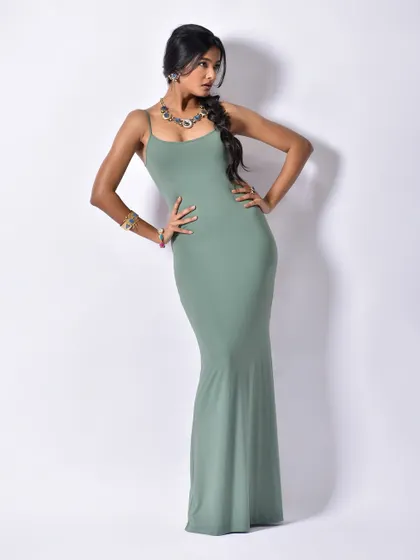 A classic, confident pose that showcases the entire look, from the silhouette of the dress to the placement of the Curiocottage jewellery.