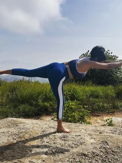 Balancing in Virabhadrasana III, or Warrior III. Finding stability on an uneven rock is a reflection of finding balance in life. It's about dancing with change and having the focus to find the still point within it all.