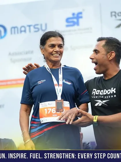 A candid moment of pure joy and celebration on stage with one of our amazing runners after she completed the race.