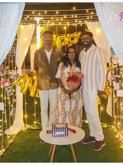 Our cabanas are perfect for family celebrations too. Here, a family poses for a photo during an anniversary surprise, surrounded by the warm glow of our decorations.