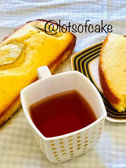 A bright and zesty lemon loaf cake, pictured here with a cup of black tea. The tangy lemon flavour makes it a wonderfully refreshing treat.