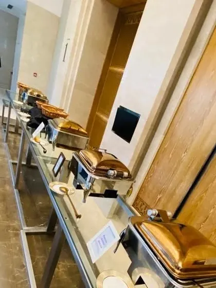 A long shot of our buffet setup for a large house warming ceremony at the prestigious Lodha World Towers. Our premium brass chafing dishes add a touch of luxury to the event.