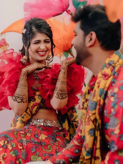 The bride's laughter is the best feedback. Here she is, enjoying her Mehendi ceremony against a backdrop of giant, colourful paper flowers I created for a fun and whimsical touch.