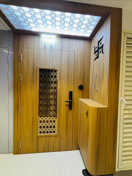 The complete entrance unit, including the door, side storage, and overhead lighting, designed to be both beautiful and practical.