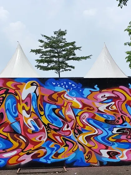The full abstract mural from the event in Jakarta. The piece is a riot of color and movement, designed to be visually overwhelming in the best way.