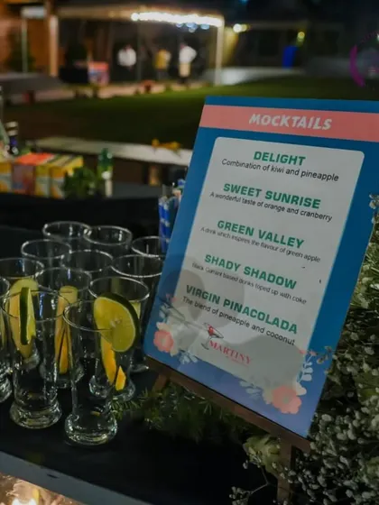A close-up of the mocktail menu and pre-garnished glasses, showcasing the attention to detail in every aspect of the event.