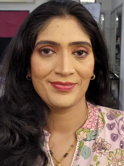 A corrective makeup look designed to brighten and lift the features. A soft pink lip and lightly defined eyes complete this fresh and elegant style.