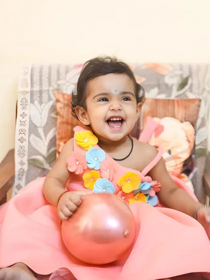 A moment of pure, uninhibited laughter from the birthday girl. These are the priceless shots every parent wants.
