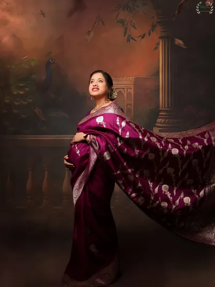 A majestic solo portrait of the mother-to-be, with her saree flowing around her. This shot captures a sense of grace and power.