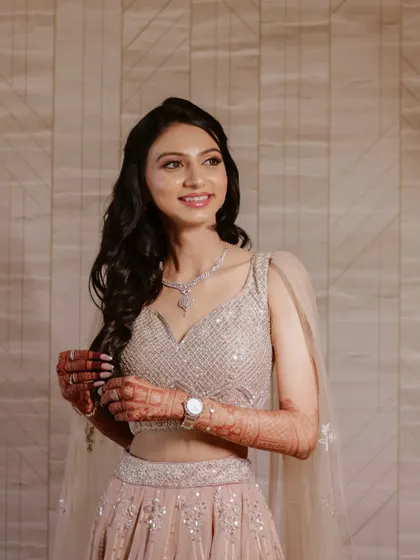 A beautiful solo portrait of the bride on her engagement day, showcasing her stunning outfit and happy smile.