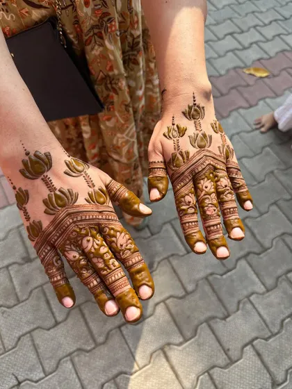 A full-hand lotus design for a client during the Karwa Chauth rush.