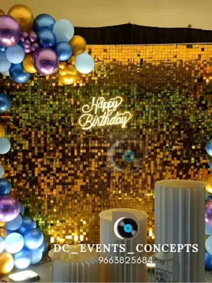 We love bringing fun themes to life for birthdays. This setup features a glamorous gold shimmer wall, a custom neon sign, and a vibrant balloon arch for a stylish celebration.