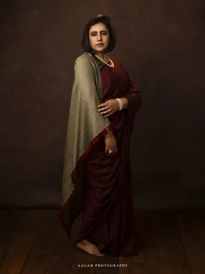 A full-length view of the saree portrait, showing the elegant and unconventional drape, creating a modern yet timeless look.