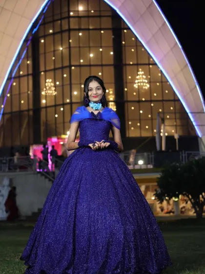Our client looking like royalty in a sparkling royal blue ball gown. This is a perfect rental option for a grand evening reception or gala.