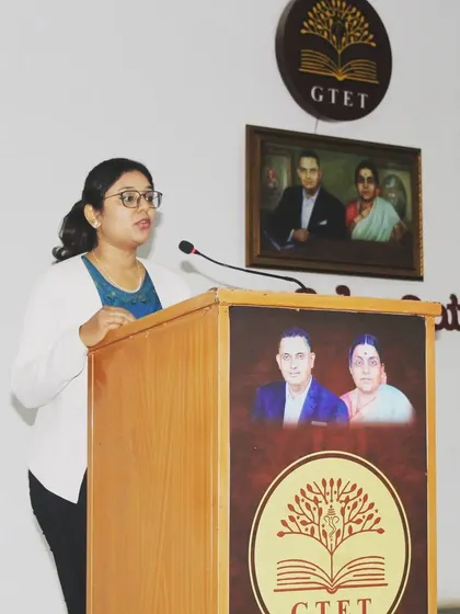 At the podium, sharing my knowledge on dermatology with the community.