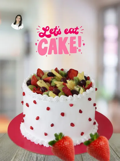A light and refreshing fresh fruit cake. The simple white cake is topped with a colorful medley of seasonal fruits like strawberries, kiwi, and grapes, and decorated with pomegranate seeds.