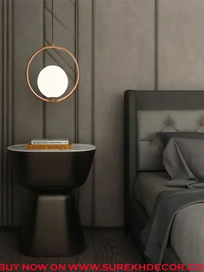 This graceful hanging light features a glowing globe within a copper-finished ring. The imported design is perfect for use as a bedside pendant or to add a touch of modern elegance to a reading nook.