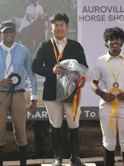 Our trainer Barath Manoharan on the podium after conquering multiple categories at the show jumping competition in Pondicherry.