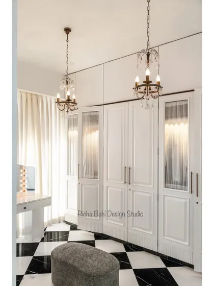 A closer look at the glamorous walk-in closet in Mumbai. The crystal chandeliers and classic design details create a space that feels like a private boutique.