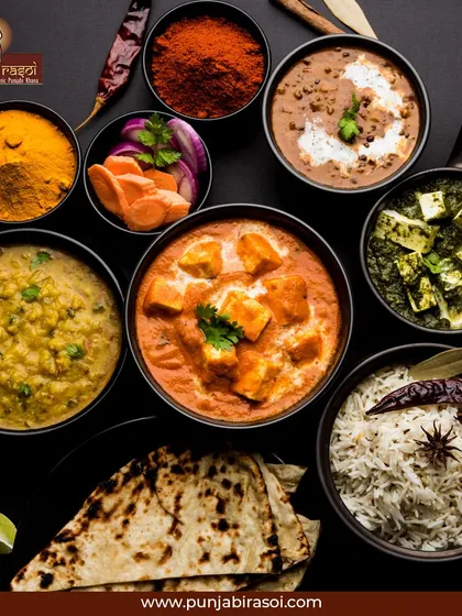 From the heart of Punjab to your plate. This beautiful flat lay shows the spices and dishes that make up our cuisine.
