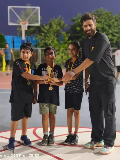 Our U-10 FireBall team, proud runners-up, receiving their trophy and medals.