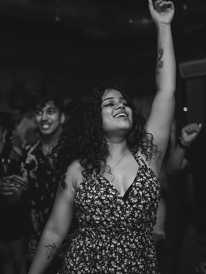 A black and white shot capturing a moment of pure joy on the dance floor. These are the memories that make every gig worthwhile.