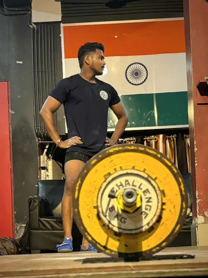 Posing in front of the Indian flag. I am proud to represent my country through my strength and dedication to powerlifting.