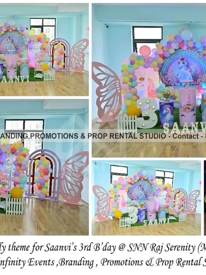 A magical combination of Unicorn and Butterfly themes for a 3rd birthday at SNN Raj Serenity. The decor features a unicorn backdrop, butterfly wing props, a pastel balloon garland, and a light-up number "3," creating a whimsical wonderland.