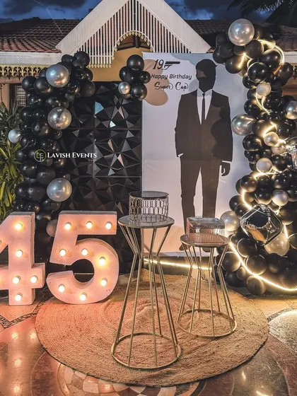 We can execute any theme with a modern twist. This "Supercop" birthday party features a sleek black and silver color scheme, marquee numbers, and a custom silhouette backdrop.