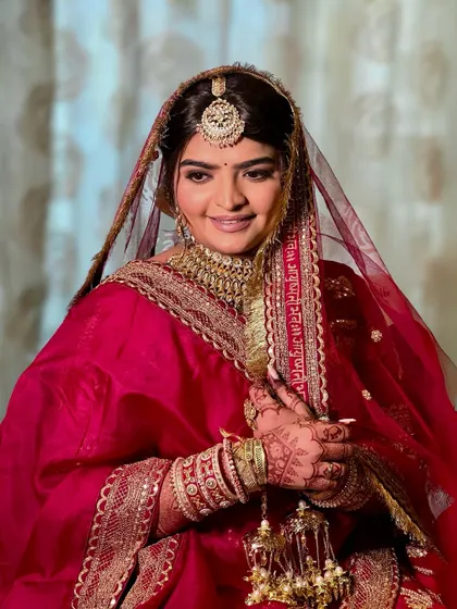 A candid shot of the bride, her happiness shining through.
