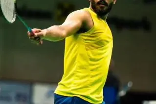 A close-up of Raghu Mariswamy's intense focus during a match at the Austria Series.