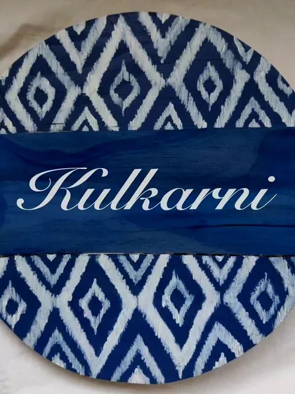 An example of our modern-traditional fusion, this circular nameplate features a bold blue Ikat pattern. It's a great way to add a contemporary Indian touch to your entrance.