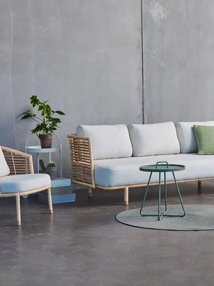 Another look at my customizable cane sofa set, this time with off-white fabric. I can source different materials and colors based on your specific request for a truly personal furniture piece.