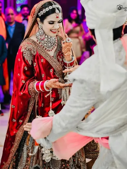 A joyful, candid moment of the bride during the wedding ceremony. Her genuine smile is what makes this photo so special and memorable.