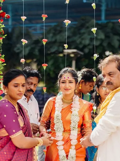 The bride being escorted by her parents. We plan the processional to be a smooth and emotional moment for the entire family.