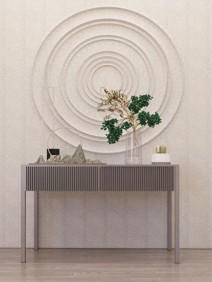 A modern console with a fluted finish and a concentric circle wall art piece, demonstrating a focus on texture and form.