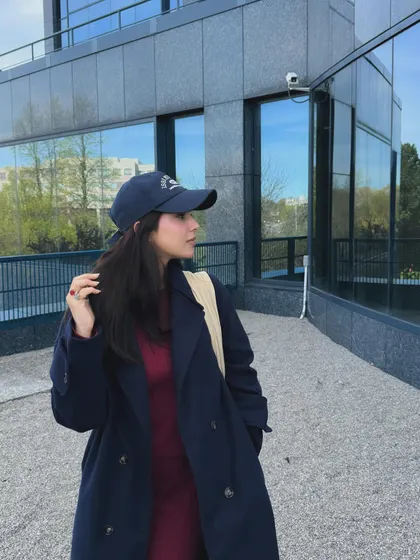 A side profile of the Trendyol coord set, paired with a trench coat and baseball cap.