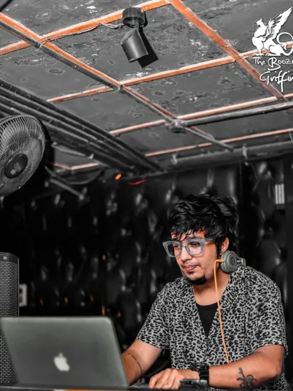A candid moment of me mixing tracks during a Bollywood night at The Boozy Griffin. My job is to blend the best hits to keep the party going.